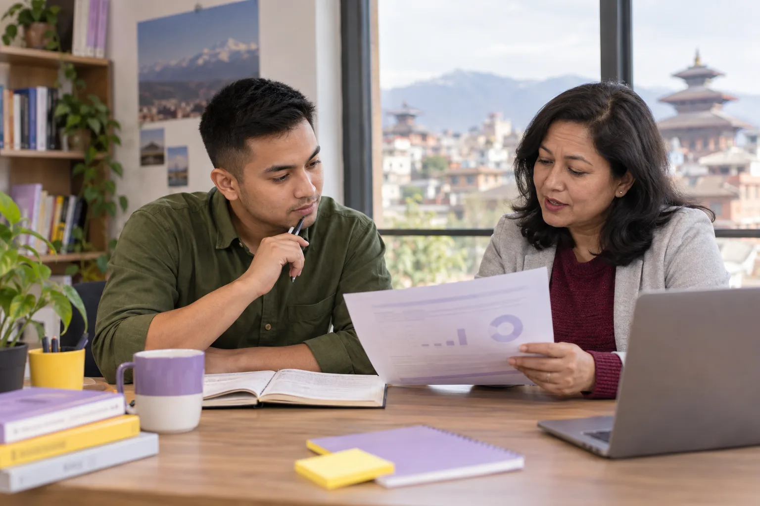 Nepali student and tutor discussing a GMAT practice chart at a study table