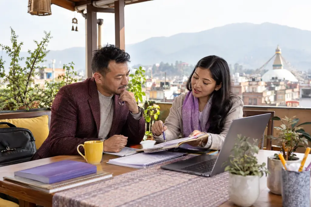 Nepali student reviews an IELTS study plan on a covered terrace