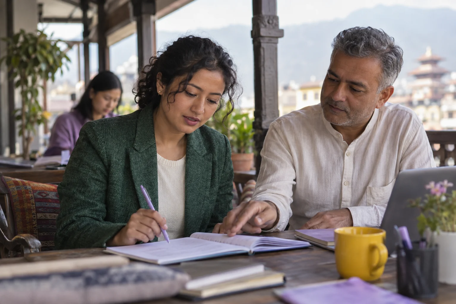 IELTS student and tutor review sentence completion notes at a Kathmandu study table