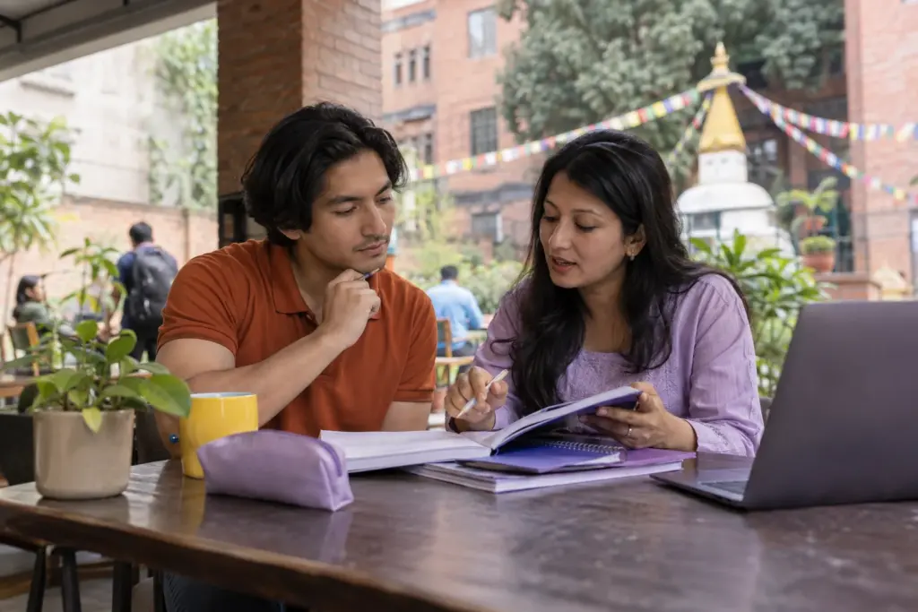 IELTS students discuss two views before planning a Task 2 essay