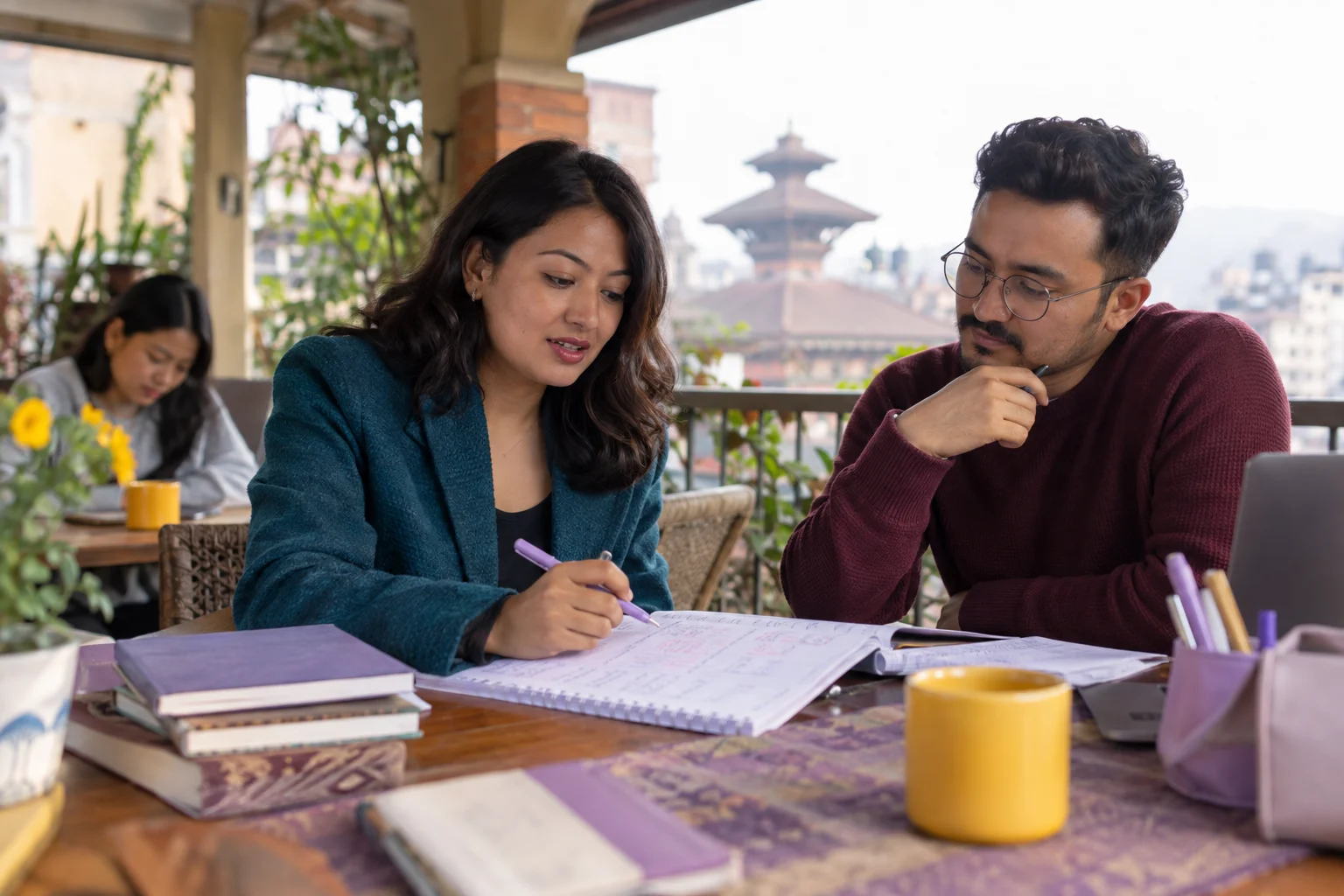 IELTS tutor checks a two-part question essay outline with a student