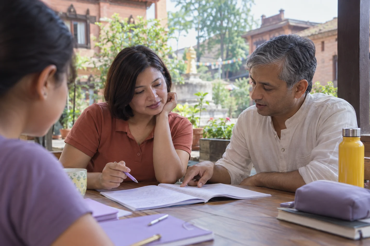 IELTS General Training Reading Part 3 study session with a learner and notes