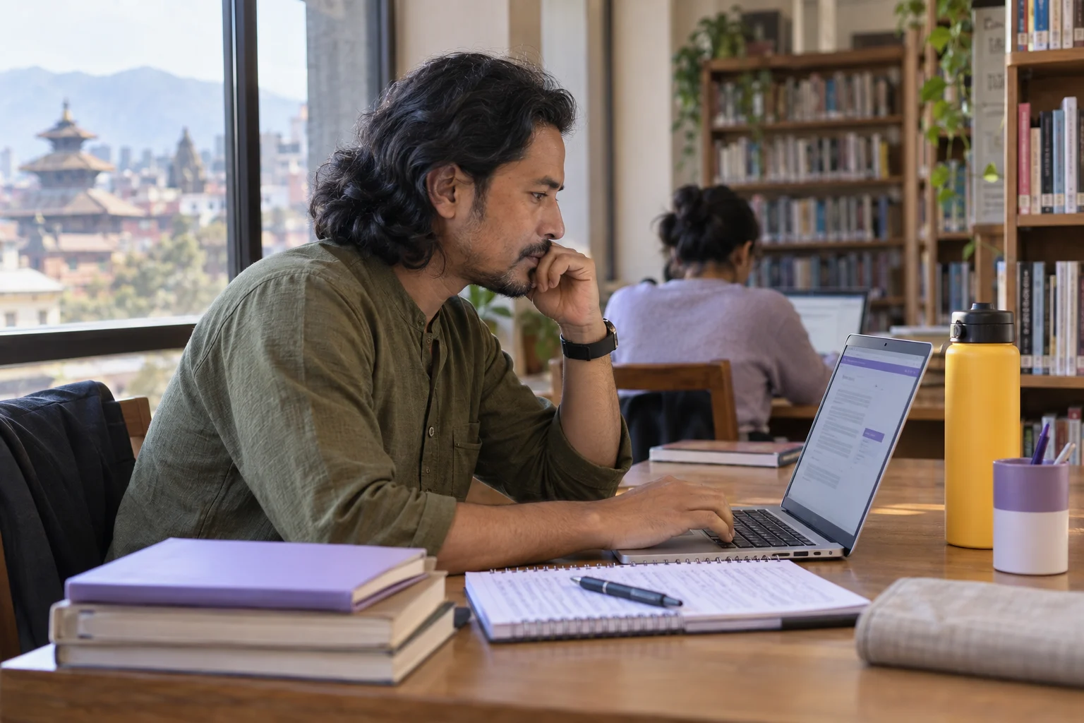 IELTS General Training computer test study session with a learner and notes