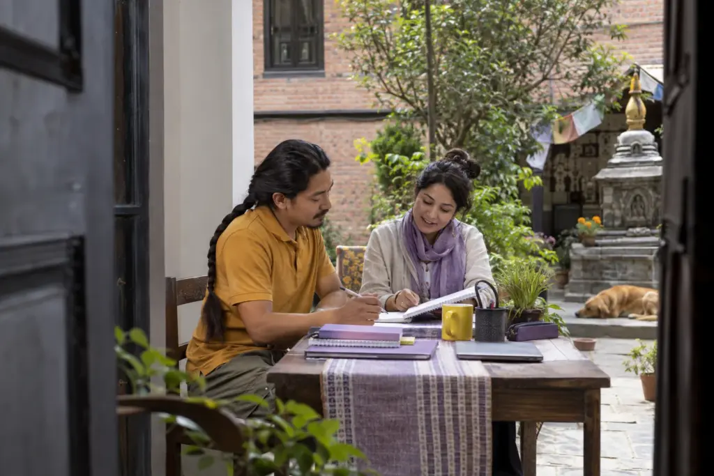 Eight-week IELTS for UKVI Academic study plan — a learner and tutor reviewing study notes