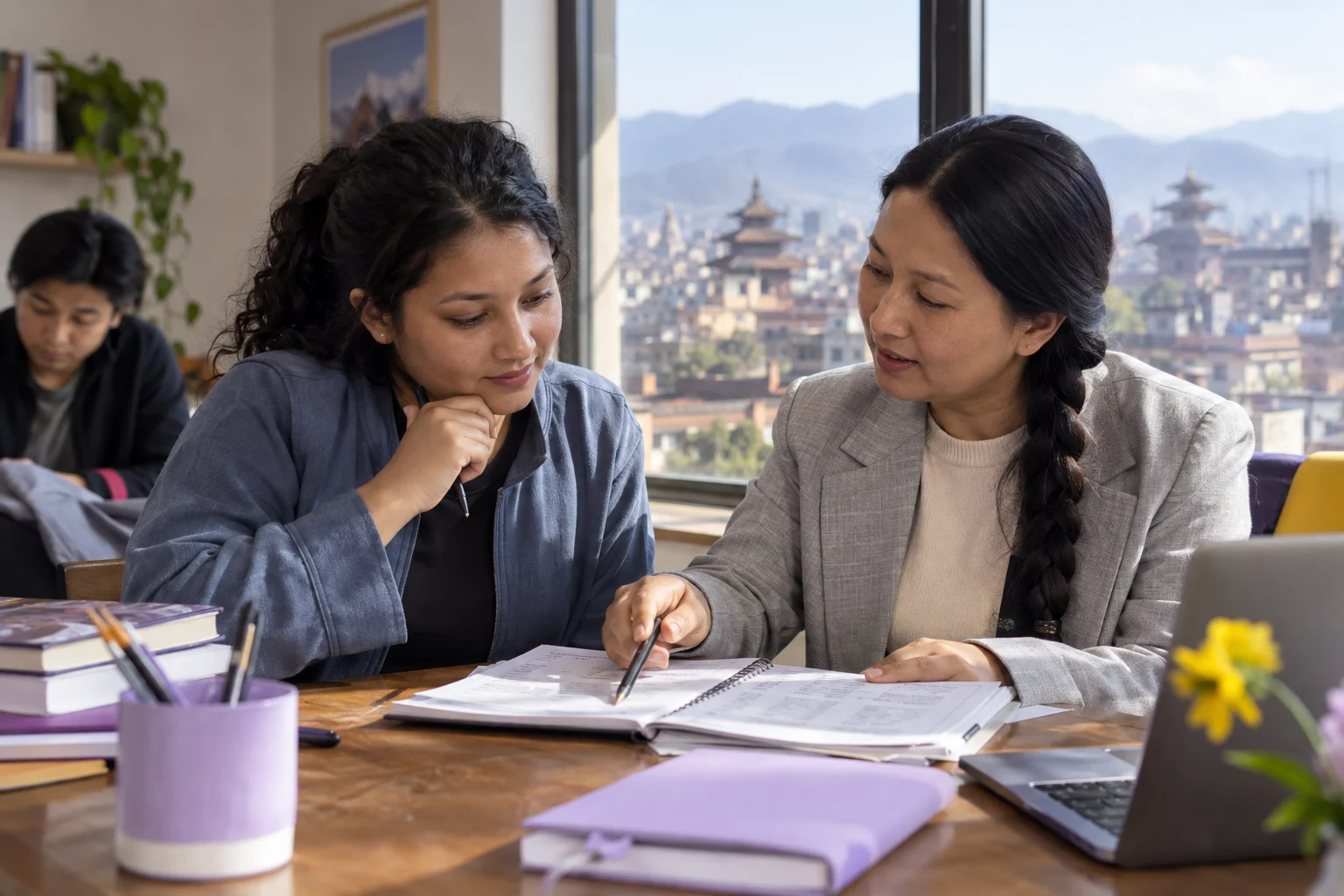 IELTS UK below-degree study English requirement — learner and mentor reviewing marked practice notes