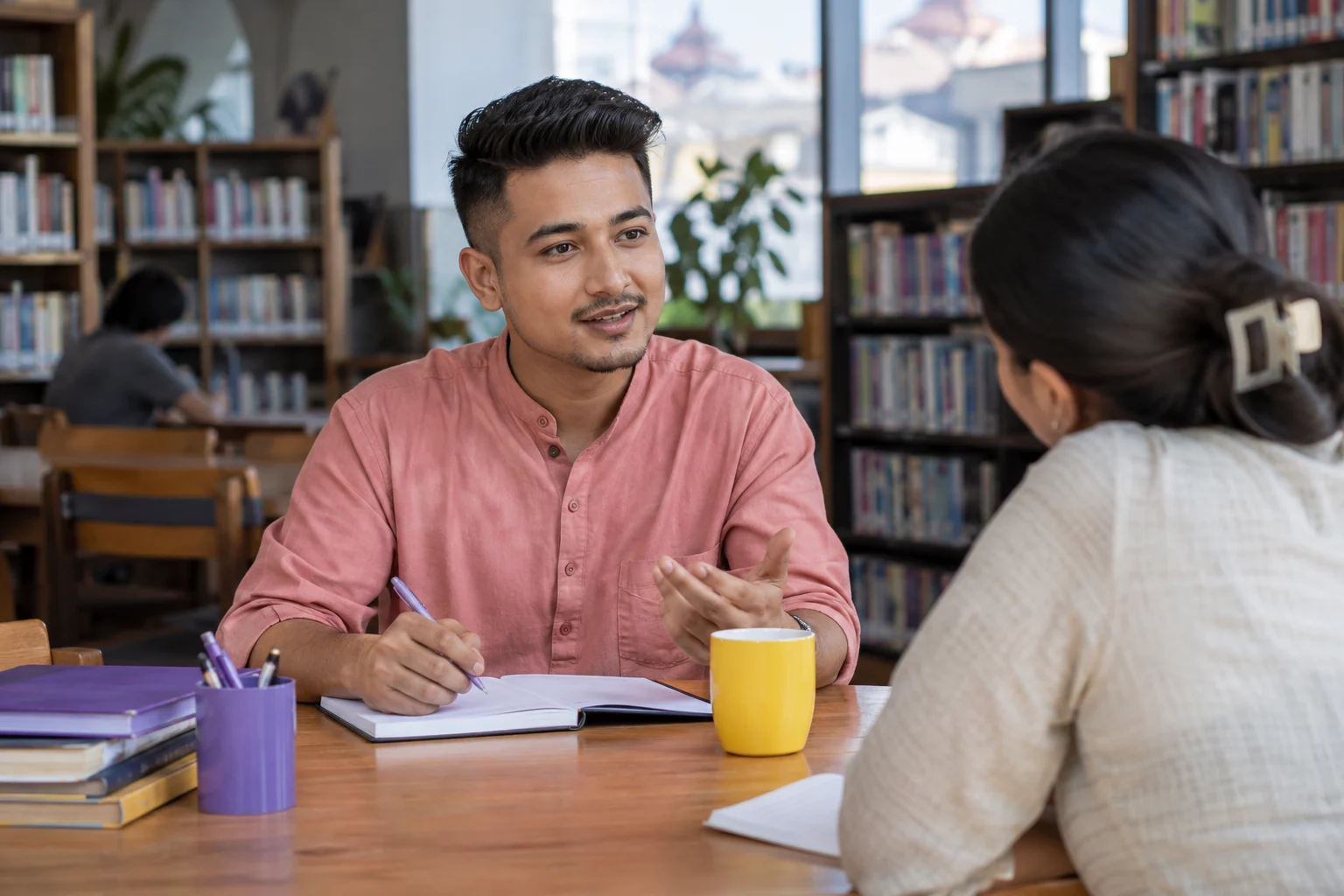 IELTS Life Skills A1 work and daily routine questions — tutor and learner practising an everyday conversation