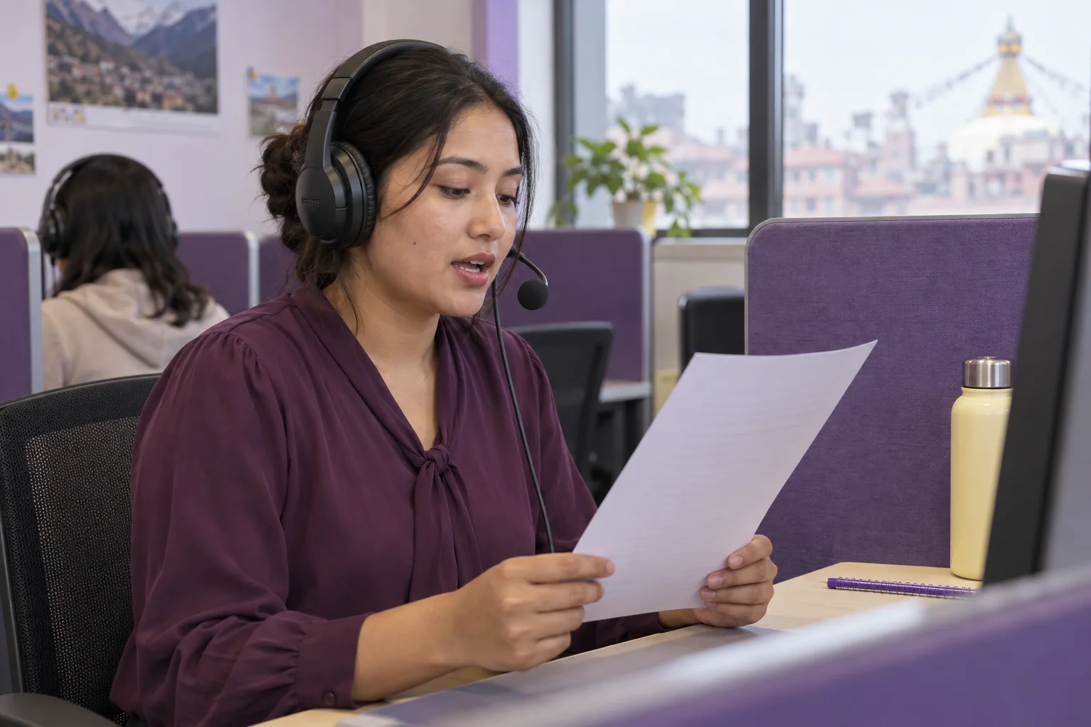 Nepali learner using a headset microphone to practise PTE Read Aloud in a language lab
